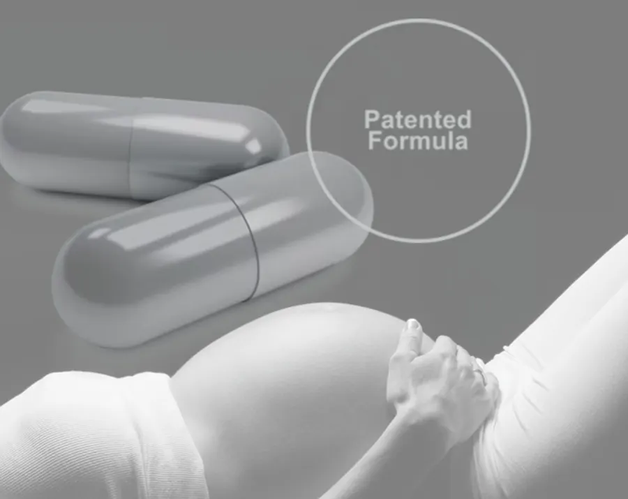Two capsules and a pregnant woman resting her hand on her belly